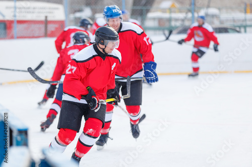 Male hockey player playing game on the rink