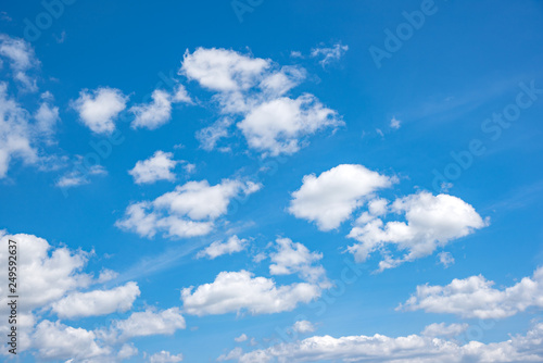 Blue sky with white clouds. Summer sky.