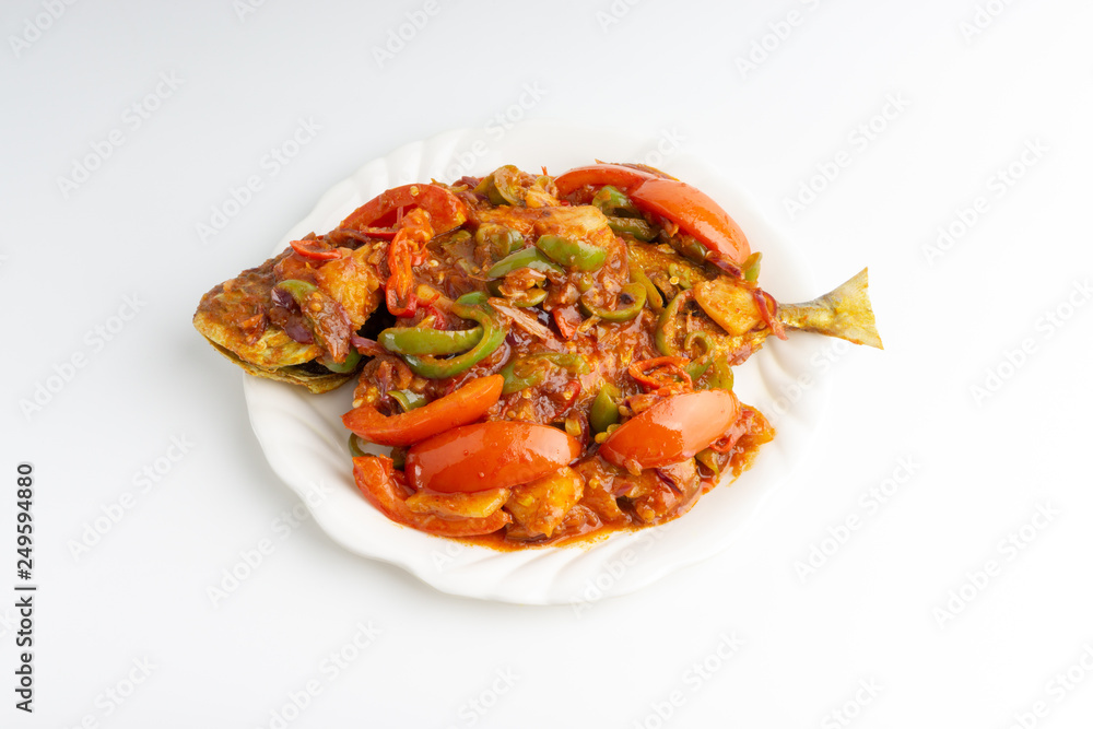 Sweet sour fried fish on white background with selective focus and crop fragment Sweet sour fried fish on white background with selective focus and crop fragment