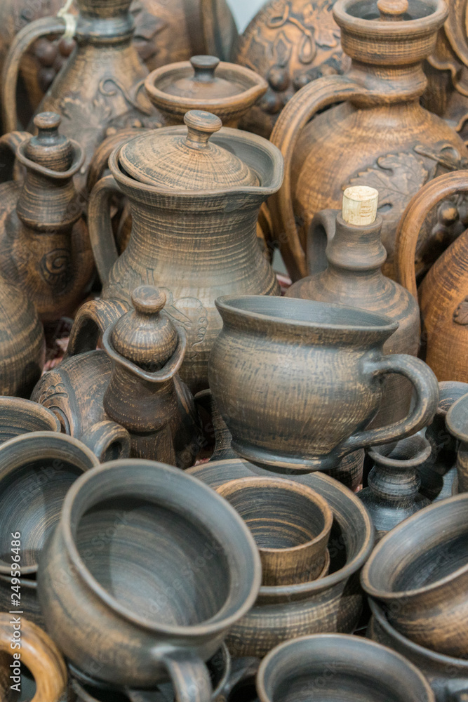 Still life with modern pottery vessels made of clay. Burnt black ceramics. Burned clay jars. vertical photo Still life with modern pottery vessels made of clay. Burnt black ceramics. Burned clay jars. vertical photo
