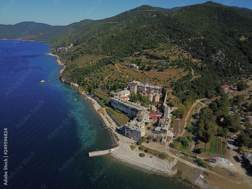 Mount Athos. Agion Oros. Sea view summer day aerial photo monastery Xenophon and green landscape.