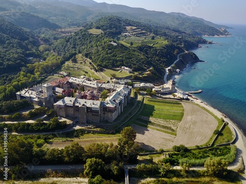 Mount Athos. Agion Oros. Sea view summer day aerial photo monastery Iviron and green landscape. photo