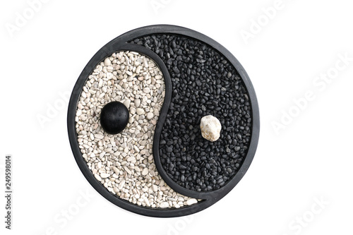 Yin and Yang Symbol made of white and black stones,