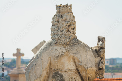 a statue of a queen on the building