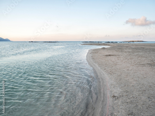 Fototapeta Naklejka Na Ścianę i Meble -  Pink sand and turquoise water early in the morning at Elafonisi Lagoon, Crete Island, Greece