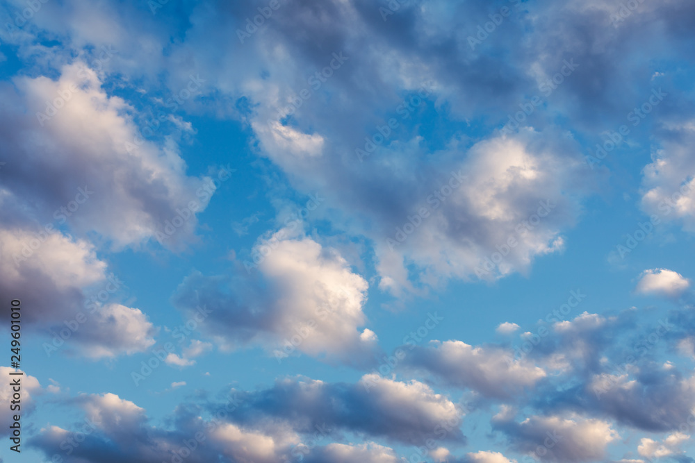 Beautiful Clouds against blue sky. Abstract Background. Blue sky with clouds and sun Beautiful Clouds against blue sky. Abstract Background. Blue sky with clouds and sun