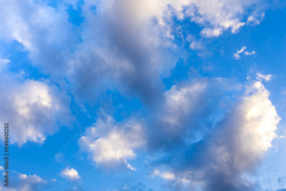 Beautiful Clouds against blue sky. Abstract Background. Blue sky with clouds and sun