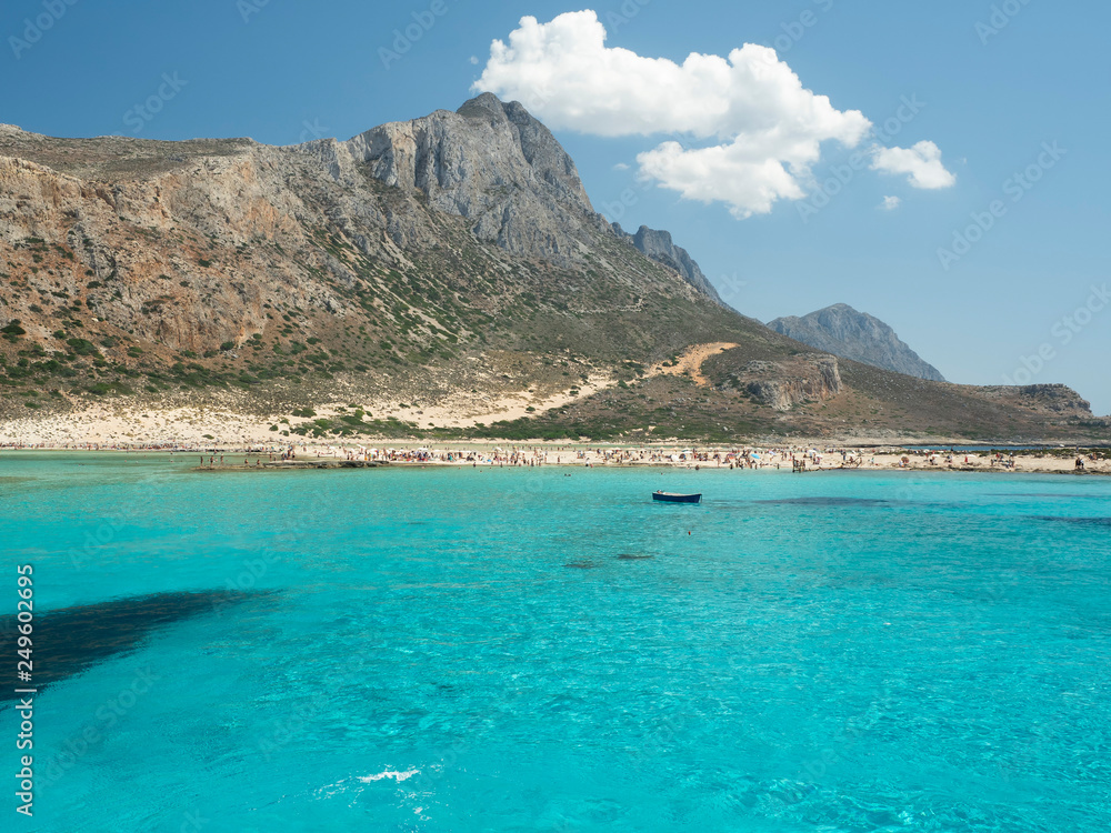 Balos Lagoon Blue sea, hills and boat, transparent water as a swimming pool, Crete Island, Greece