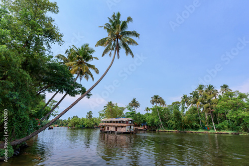 Papier peint River view and traditional house boat in Kerala's Backwaters, India