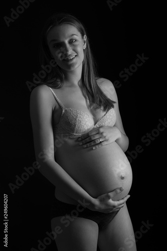Black and white studio photography of a beautiful pregnant woman © Samo Trebizan
