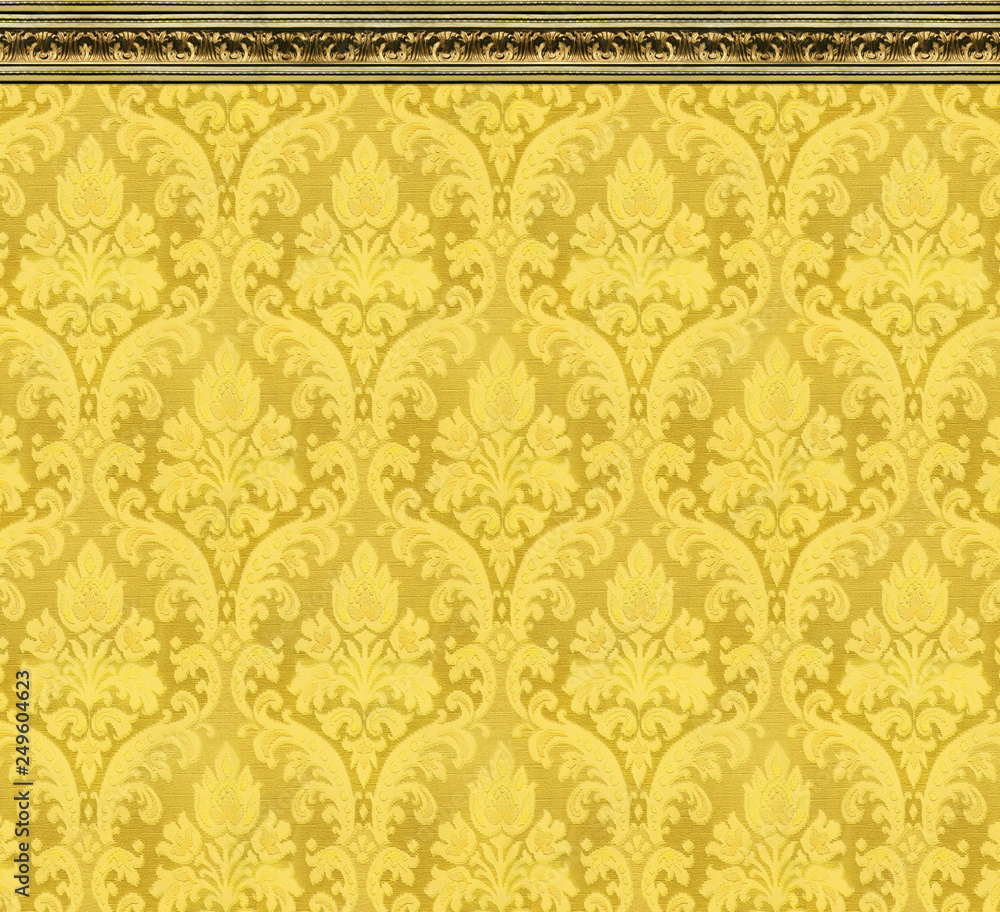 Elegant Wall of Yellow Damask Wallpaper With Ornate Molding Stock Photo