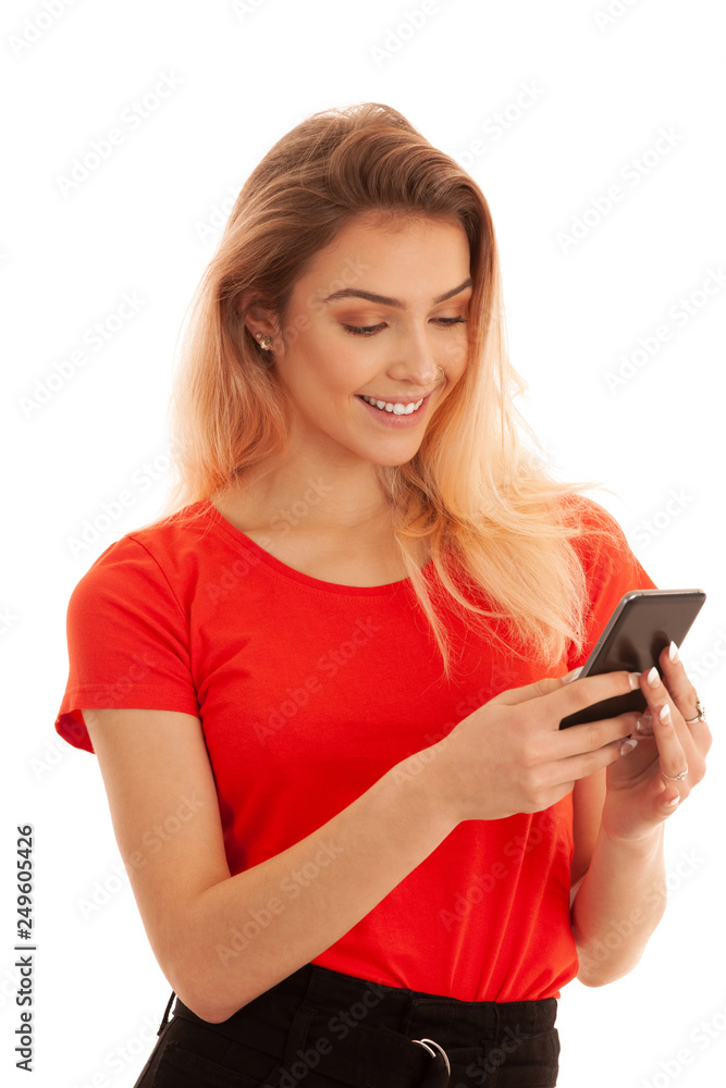 Beutiful young woman texting message on a smartphone isolated over white background Beutiful young woman texting message on a smartphone isolated over white background