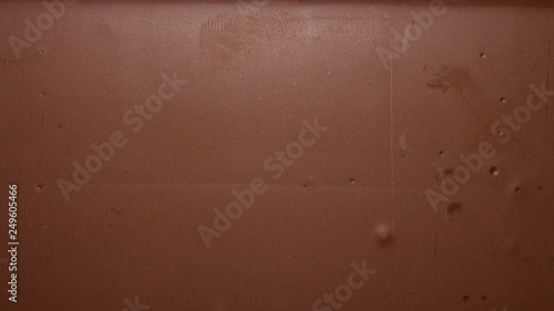 Smooth texture of milk chocolate.Chocolate photo background.