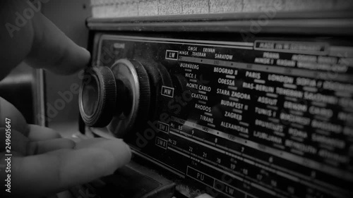 Very Old Vintage dusty Radio, hand turning the Volume On