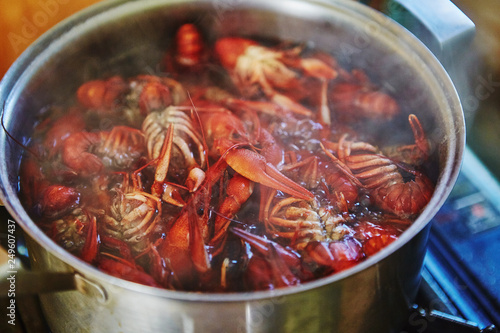 Crawfish cooking boiling in pot with spices