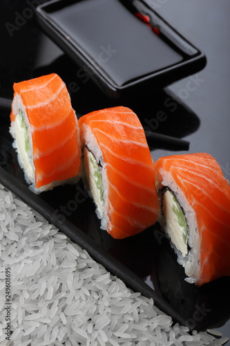 Philadelphia roll sushi with salmon, prawn, avocado, cream cheese. Sushi menu. Japanese food. copy space.