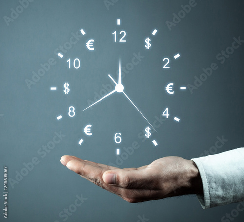 Hand holding clock. Time is money. Business time management