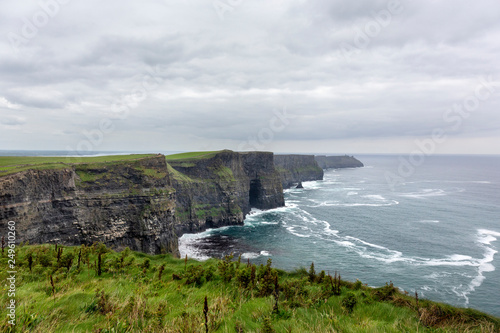 Ireland countryside tourist attraction in County Clare. The Cliffs of Moher and castle Ireland. Epic Irish Landscape UNESCO Global Geopark the wild atlantic way