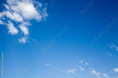 Clean Bright Blue Sky with Fluffy Clouds