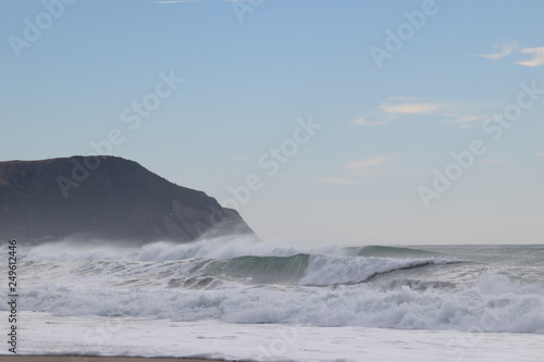 The waves crash over the shoreline in Gisborne, New Zealand.