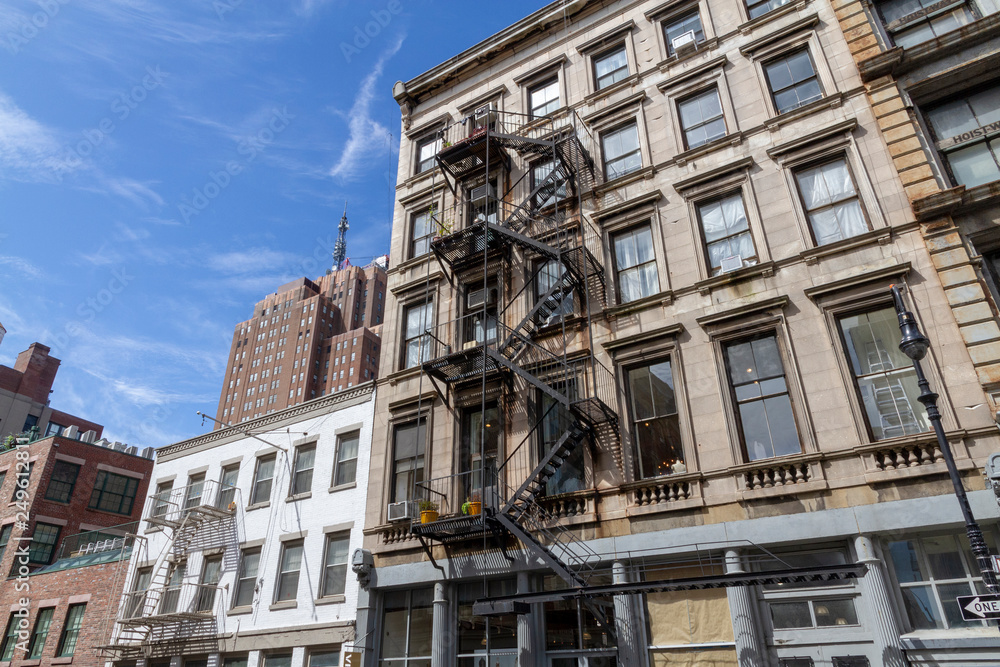 new york Fire escape stairs-downtown back alley architecture-steel and yellow brick background