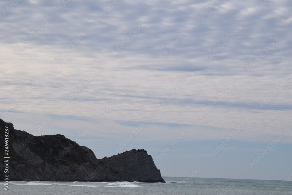 The pennisula meets the shoreline as the sky starts to grey in Gisborne, New Zealand. The pennisula meets the shoreline as the sky starts to grey in Gisborne, New Zealand.