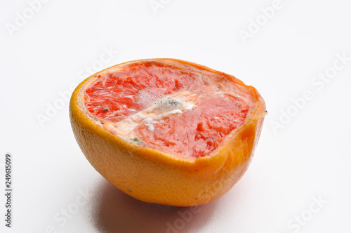 Ripe half of pink grapefruit citrus fruit isolated on white background