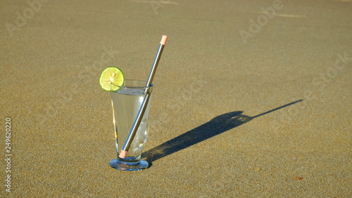 glass of water with stainless steel reuseable straw photo