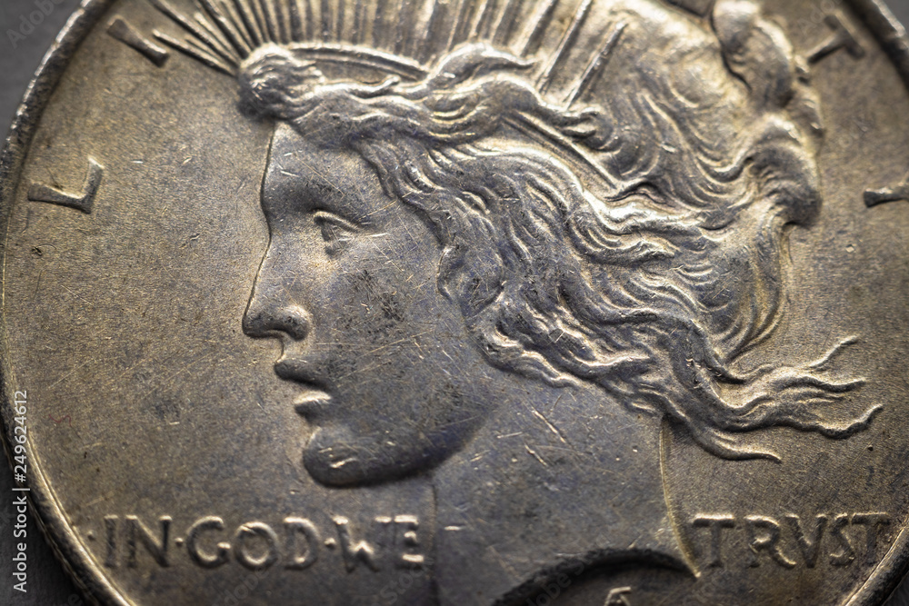 silver coin one usd. the inscription 