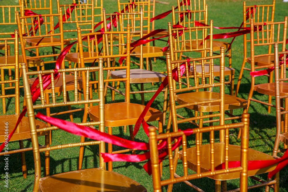 wedding ceremony, chairs decorated with roses wedding ceremony, chairs decorated with roses