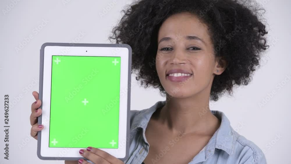 Face of young happy African woman showing digital tablet Face of young happy African woman showing digital tablet