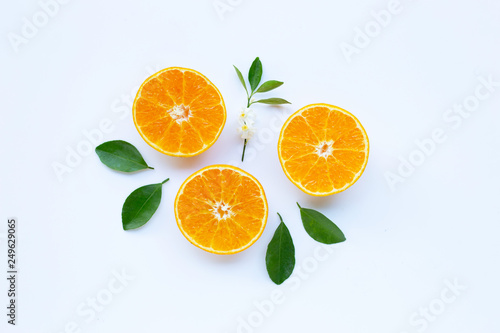 High vitamin C  Orange fruits with leaves on white background.