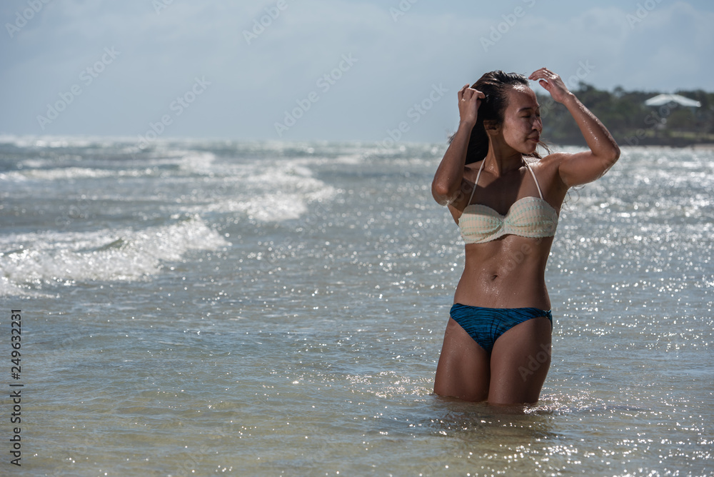 Naklejka premium young woman on the beach