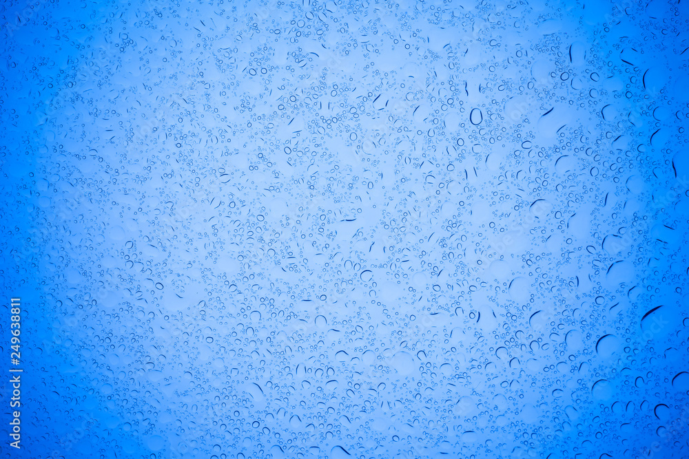 Rain droplets on blue glass background, Water drops on blue glass. Rain droplets on blue glass background, Water drops on blue glass.