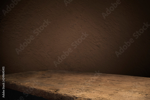 Old wood table with flame effect on dark background.
