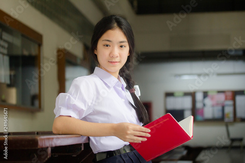 asia thai high school student uniform beautiful girl read a book
