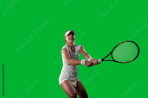 Girl tennis player on green background.