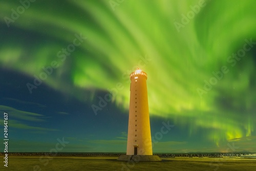 Fotografi This beautiful northern lights or aurora borealis in Iceland was taken at or around lighthouse near Keflavik during a winter night