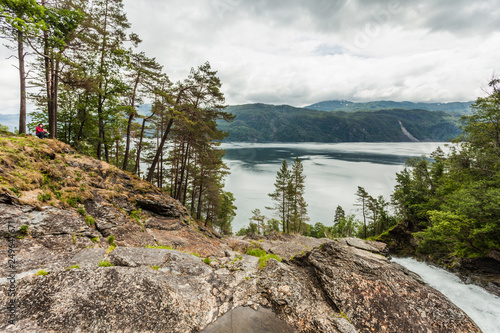 Female tourist enjoy fjord view in Norway photo