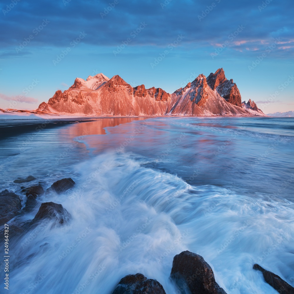 Magical Vestrahorn Mountains and Beach in Iceland at sunrise. Panoramic view of an Icelandic amazing landscape. Vestrahorn mountain on the Stokksnes Peninsula, Hofn, Iceland. Golden circle 