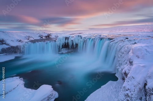 Godafoss waterfall at sunset - Views around Iceland  Northern Europe in winter with snow and ice. One of the most powerful waterfalls in Europe. Beautiful winter landscape concept background