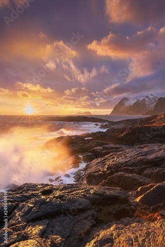 Sunset or sunrise panoramic view on stunning mountains in Lofoten islands, Norway, Mountain coast landscape, Arctic circle. Dramatic weather of a magic sunrise during this last winter. Amazing concept © Michal