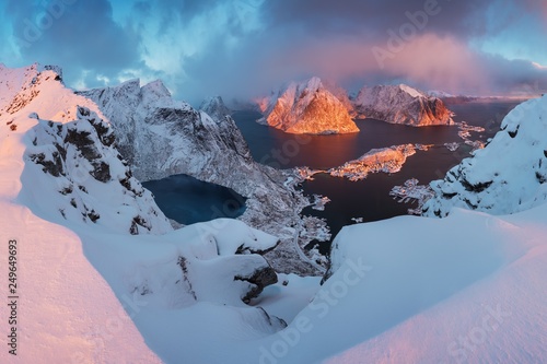 Sunset or sunrise panoramic view on stunning mountains in Lofoten islands, Norway, Mountain coast landscape, Arctic circle. Long exposure of a magic sunrise during this last winter