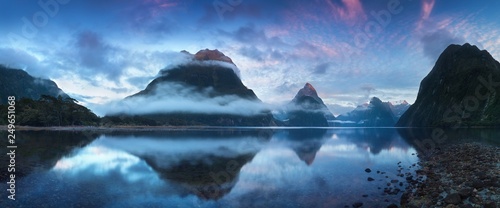 Beautiful sunrise in Milford Sound, New Zealand. - Mitre Peak is the iconic landmark of Milford Sound in Fiordland National Park, South Island of New Zealand Reflection of Mitre peak in the water photo