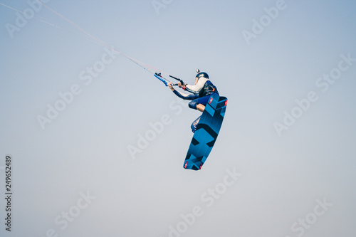 Kite surfer performing difficult tricks in high winds. Extrme sports shot in Tarifa, Andalusia, Spain