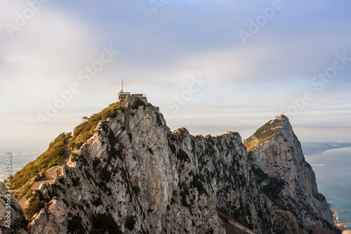 Panorama of top of Gibraltar Rock  United Kingdom   in Upper Rock Natural Reserve  on the left town and bay  La Linea town in Spain at the far end  Mediterranean Sea on the right.