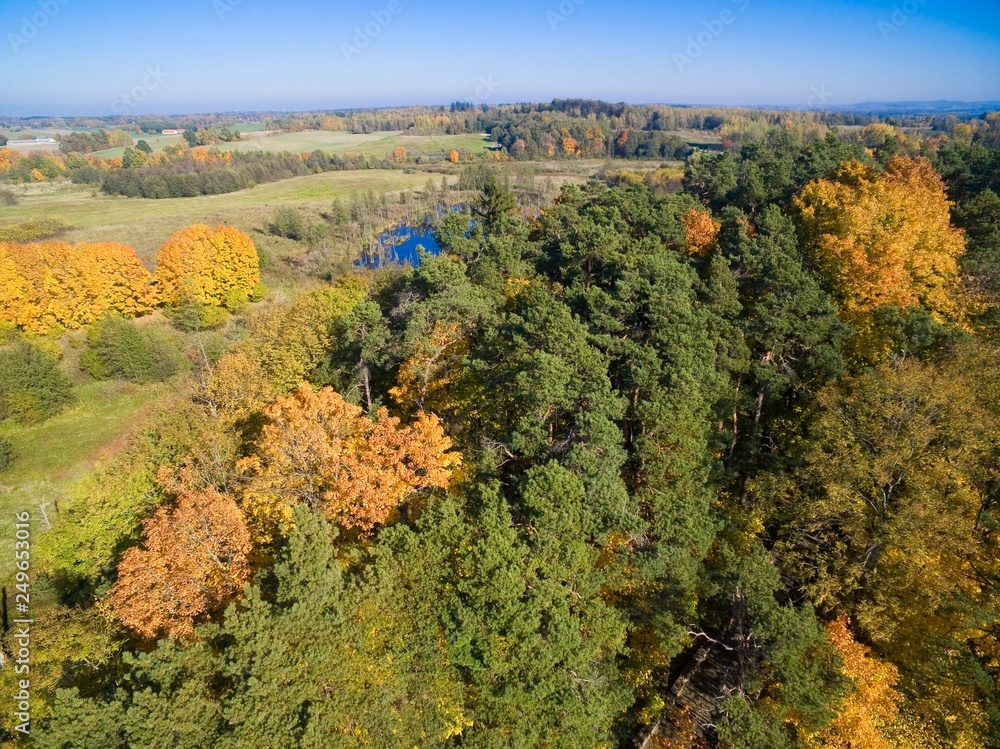 Aerial view of beautiful landscape of Mazury region during autumn season, Konopka Hill (Góra Konopki) in the foreground, Wegorzewo, Poland Aerial view of beautiful landscape of Mazury region during autumn season, Konopka Hill (Góra Konopki) in the foreground, Wegorzewo, Poland