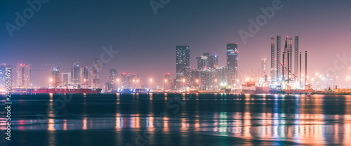 Canvas Print The Dubai skyline at night from Port Rashid, Dubai, UAE