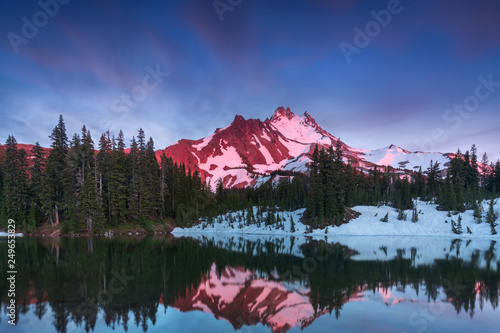 At 10,492 feet high, Mt Jefferson is Oregon's second tallest mountain. Reflected here in Scout Lake at sunset. The snow covered central Oregon Cascade volcano Mount Jefferson. Wilderness Area, Oregon © Michal