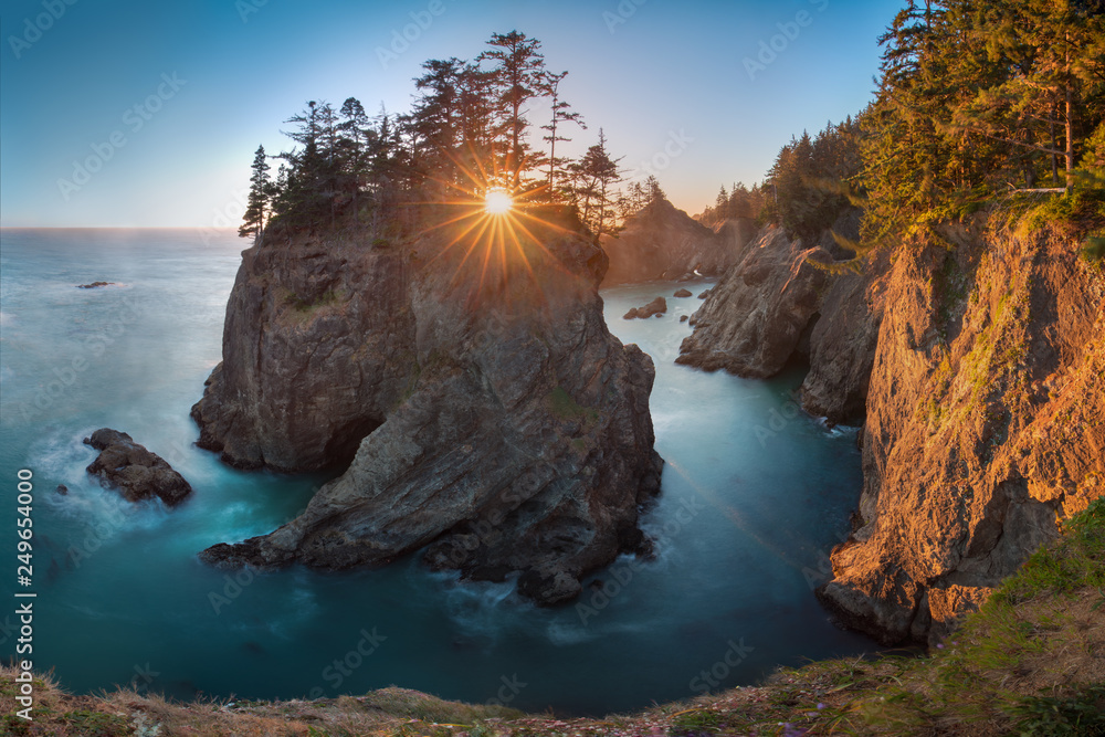 Sunset at Natural Bridges along Samuel H. Boardman State Scenic Corridor, Oregon during a golden